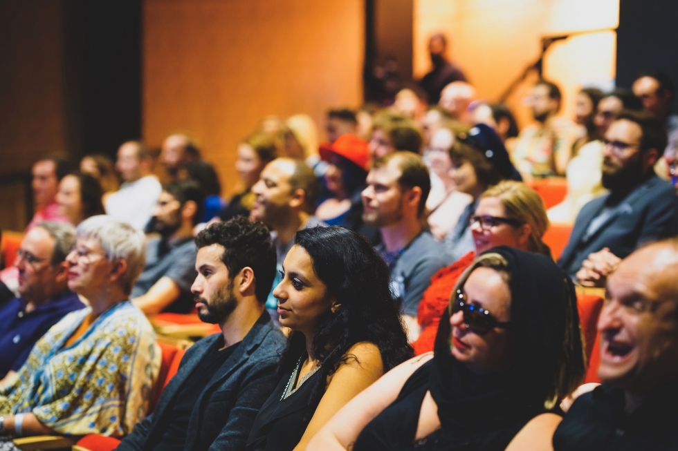 Audience in the Spy Museum theatre